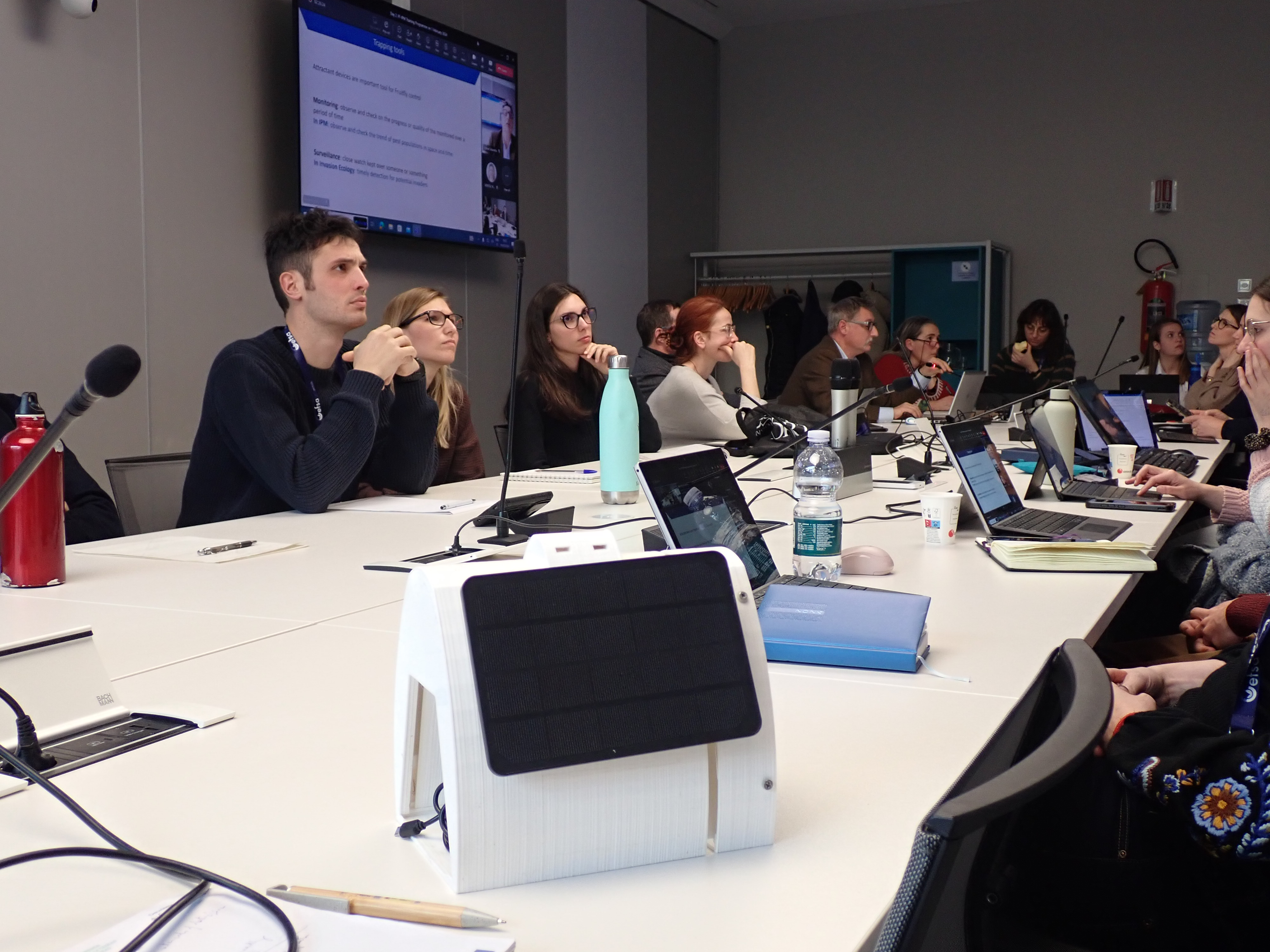 Andrea Sciaretta presenting the functioning of the electronic fruit fly trap (shown in the foreground) to physical and virtual audience during the 119th Plant Health Plenary Meeting at EFSA.